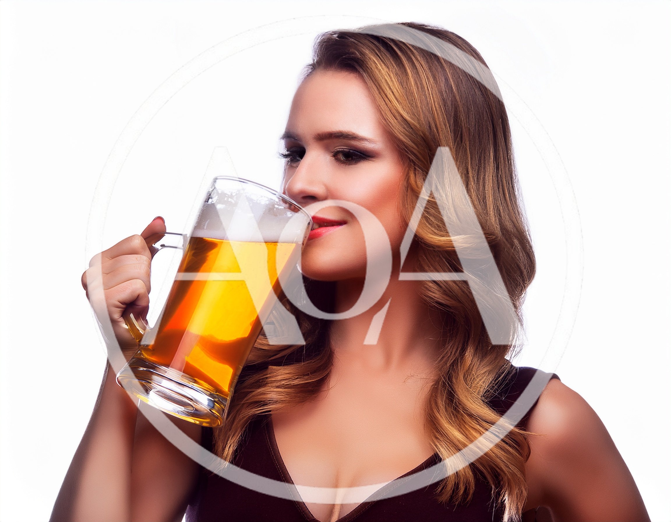 Young Woman Drinking Beer From A Glass Mug