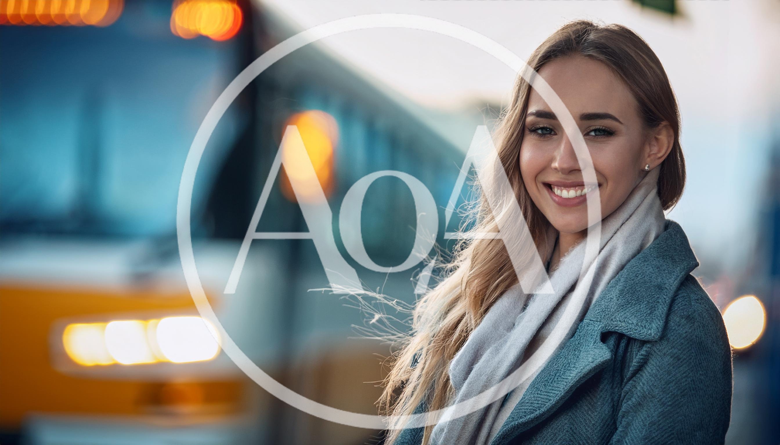 Young Woman Smiling While Waiting At A Train Station