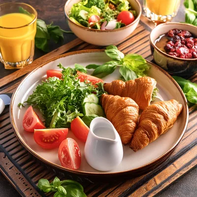 Gourmet Breakfast Plate With Croissants And Fresh Salad