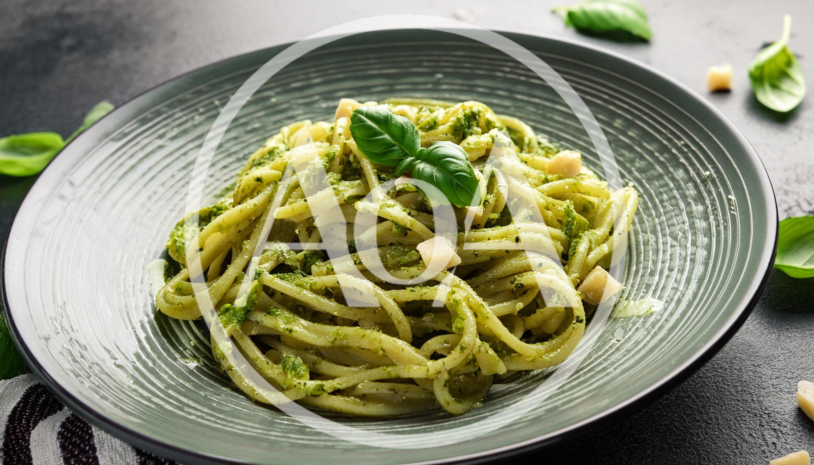 Spaghetti Pasta With Pesto Sauce And Parmesan Cheese