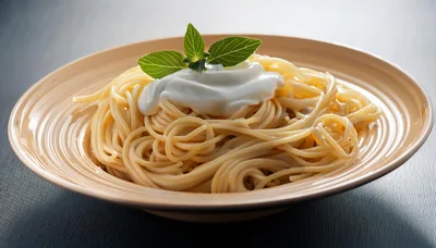 Spaghetti Pasta Topped With Creamy Sauce And Fresh Basil