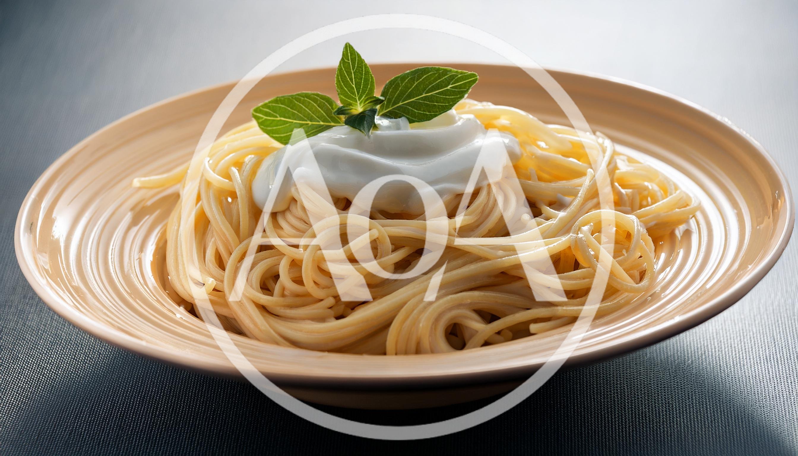 Spaghetti Pasta Topped With Creamy Sauce And Fresh Basil
