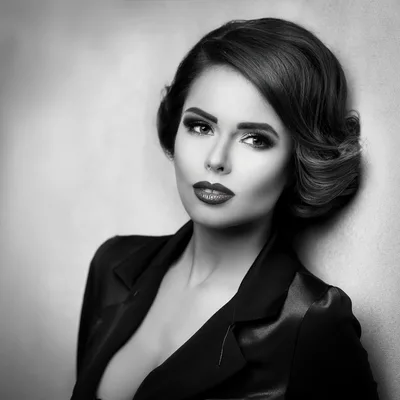 Elegant Woman With Vintage Hairstyle In Black Blazer