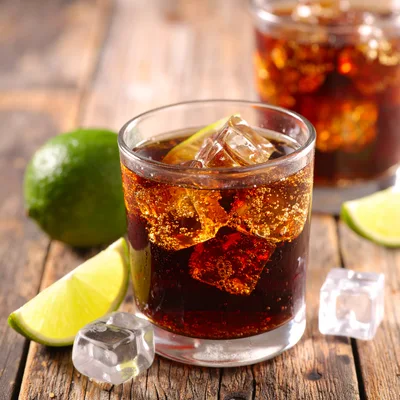 Glass Of Cola With Lime And Ice Cubes