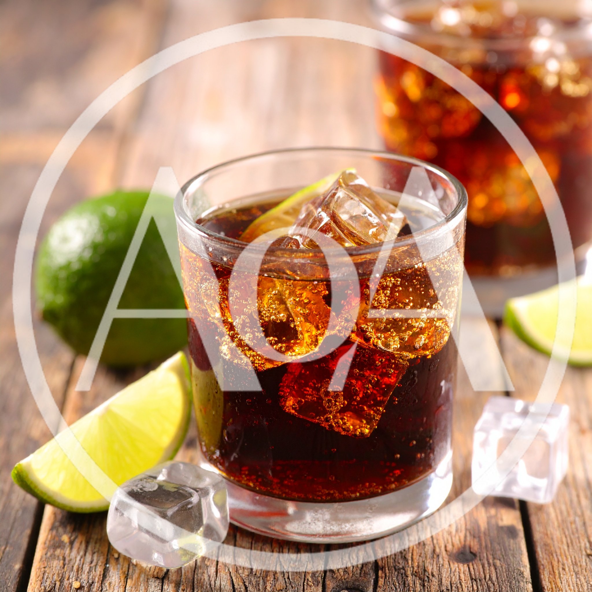 Glass Of Cola With Lime And Ice Cubes