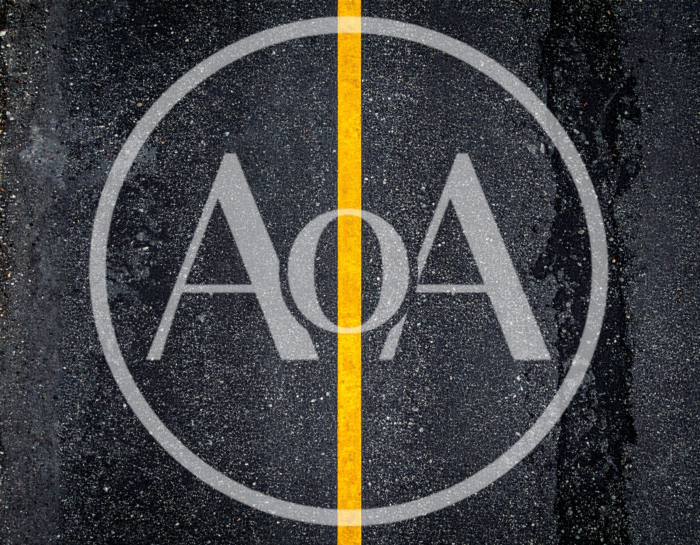 Aerial View Of A Wet Asphalt Road With Yellow Line