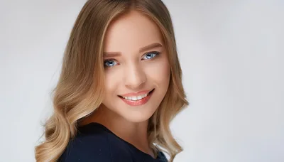Portrait Of A Smiling Young Blonde Woman