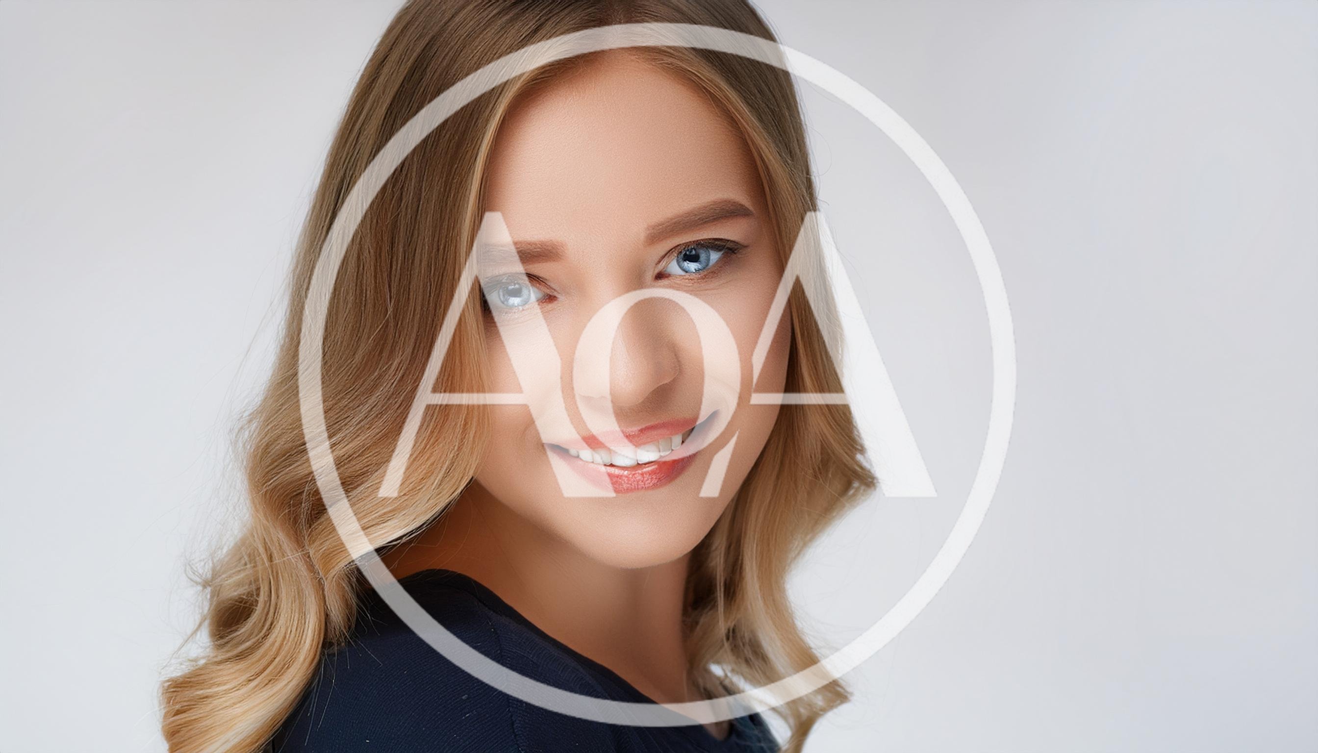 Portrait Of A Smiling Young Blonde Woman