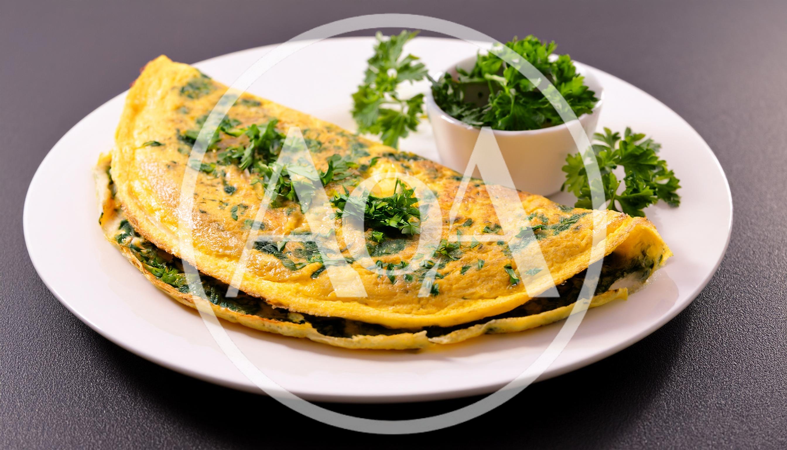 Fresh Herb Omelet Served On A White Plate