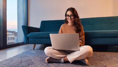 Young Woman Working On Laptop At Home