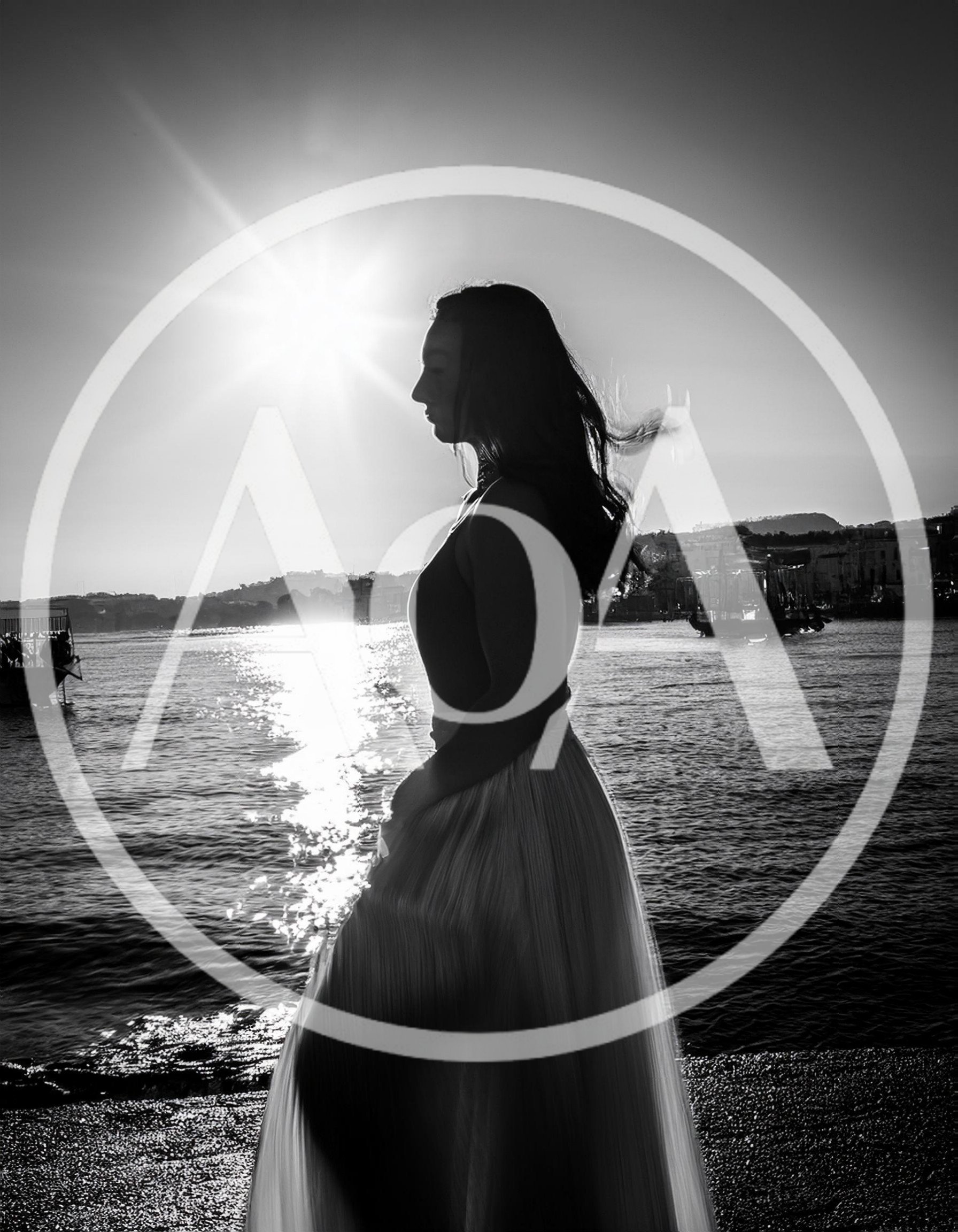 Silhouette Of A Woman Standing By The Sea