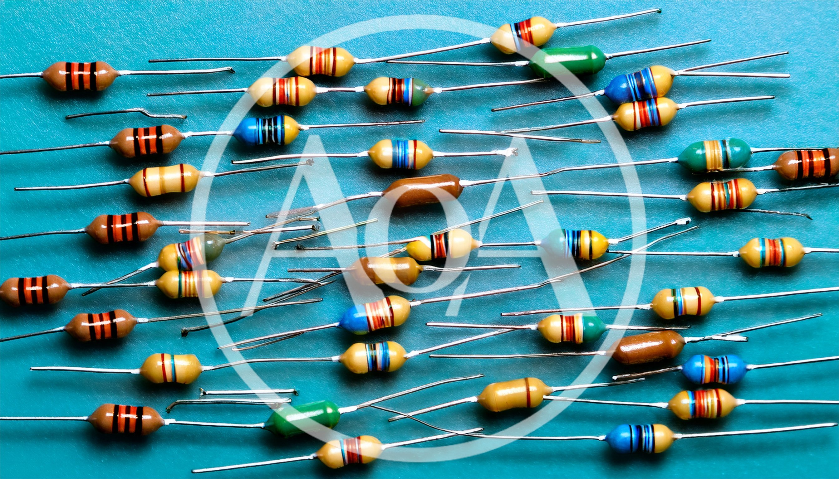 Assorted Electronic Resistors Scattered on Blue Background