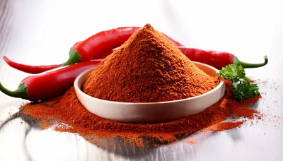 Wooden Bowl Filled With Ground Red Chili Pepper Powder