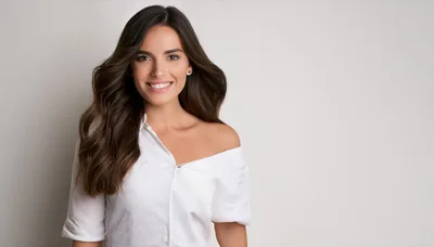 Portrait Of A Smiling Woman In A White Shirt