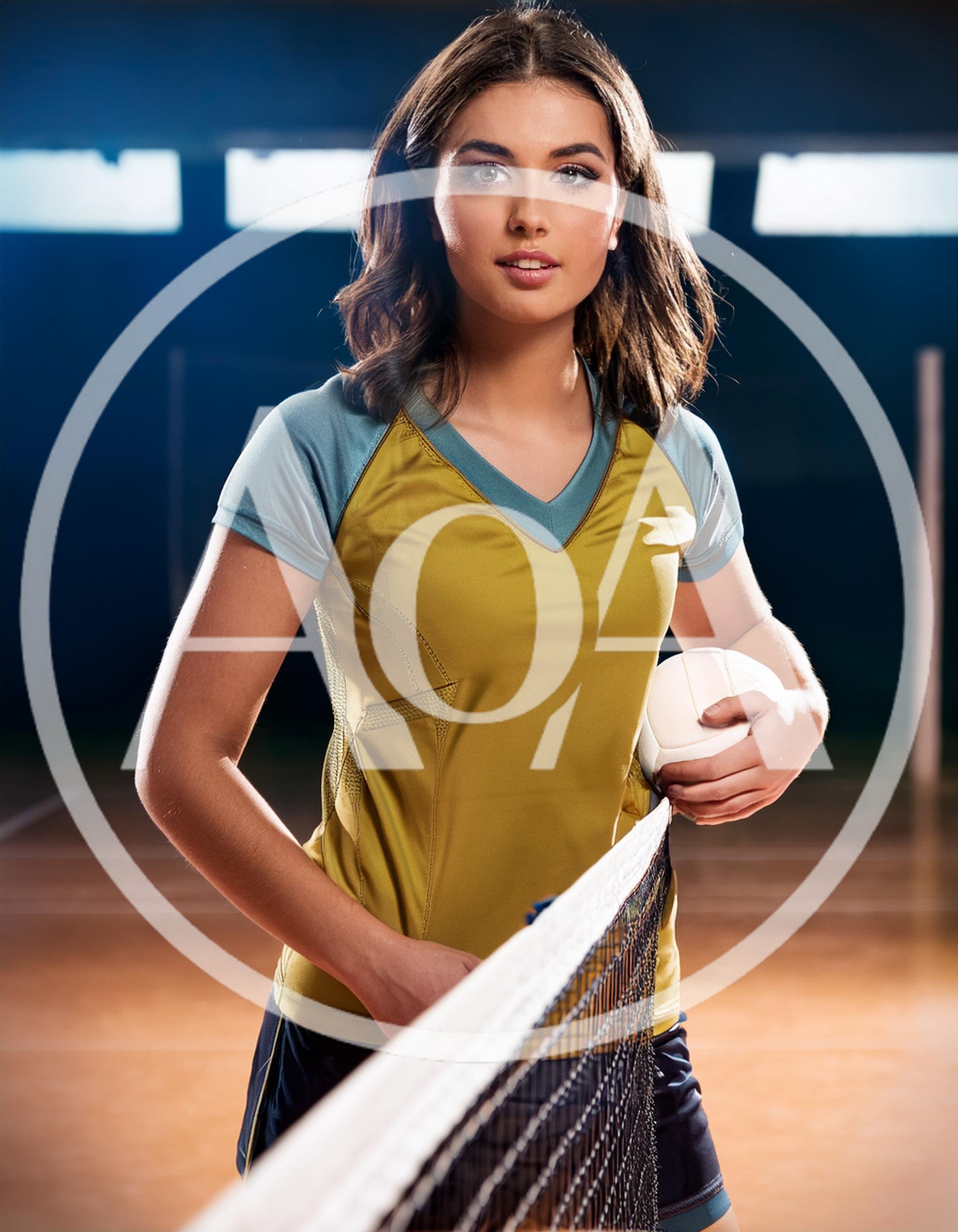 Young Female Volleyball Player Holding Ball By The Net