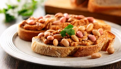 Two Slices Of Toasted Bread Topped With Bean Spread