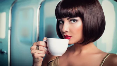 Elegant Woman With Bob Haircut Drinking From White Cup