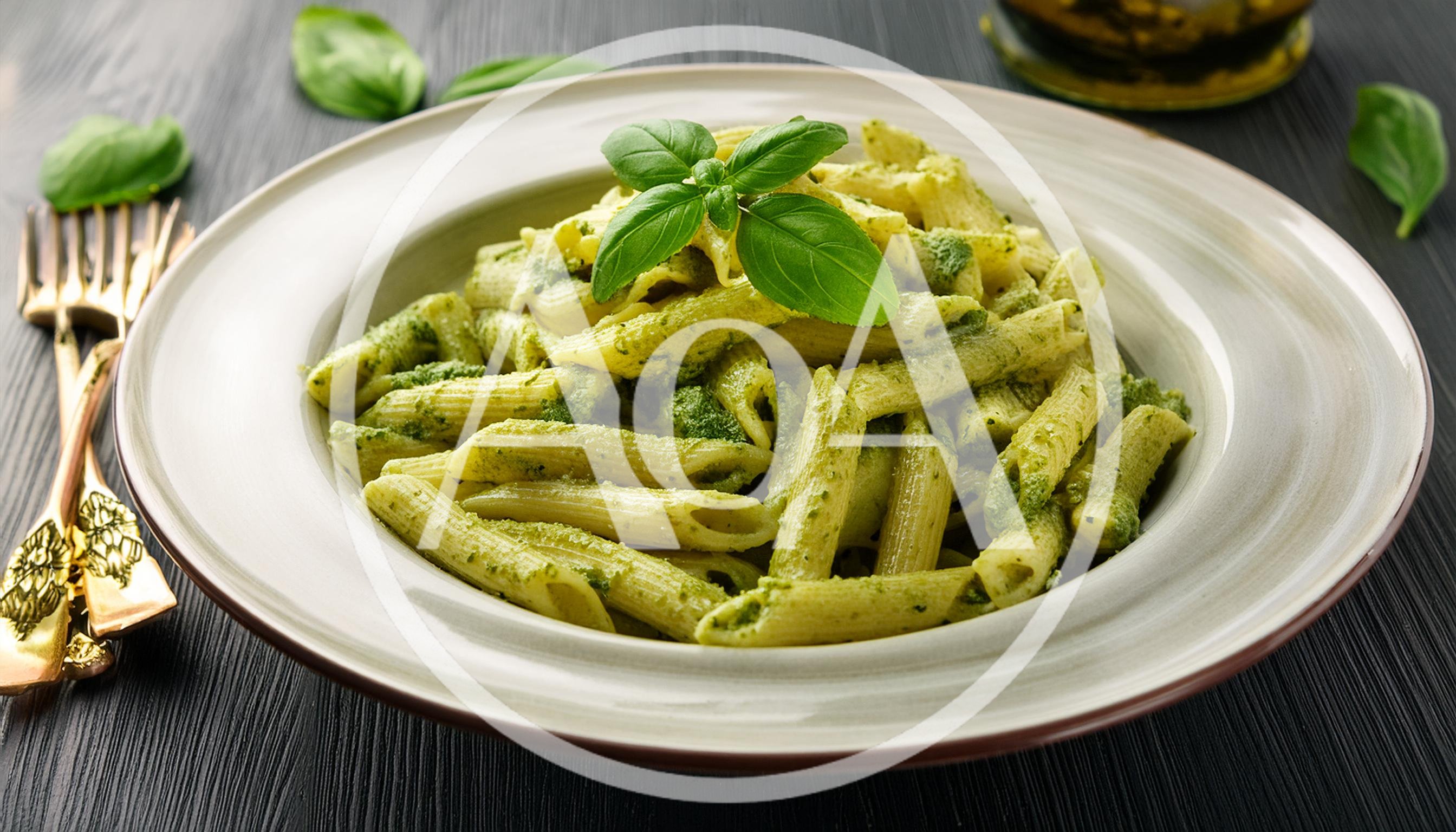 Penne Pasta With Pesto Sauce In A Ceramic Bowl