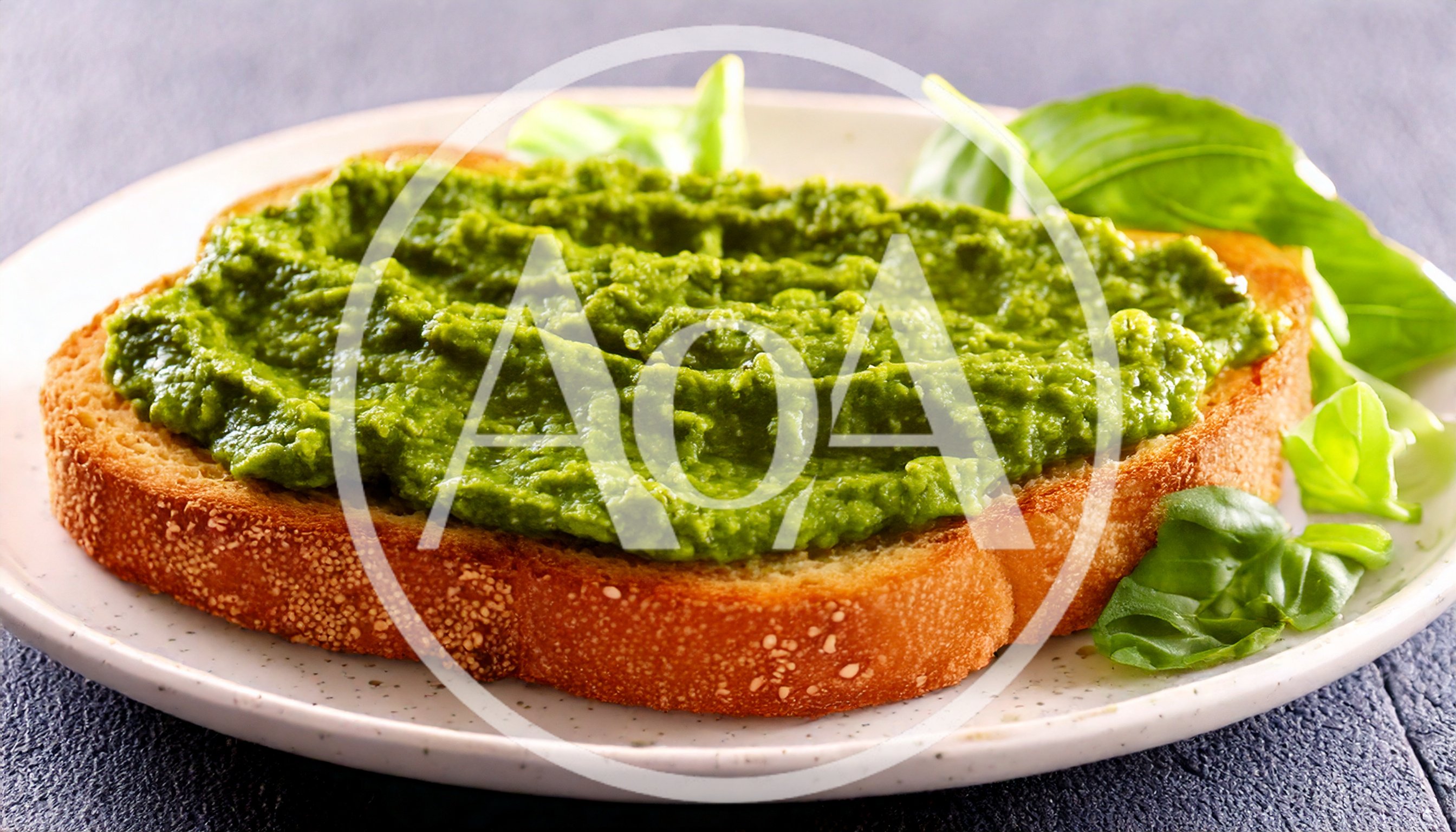 Toasted Bread Slice Topped With Green Pesto Spread
