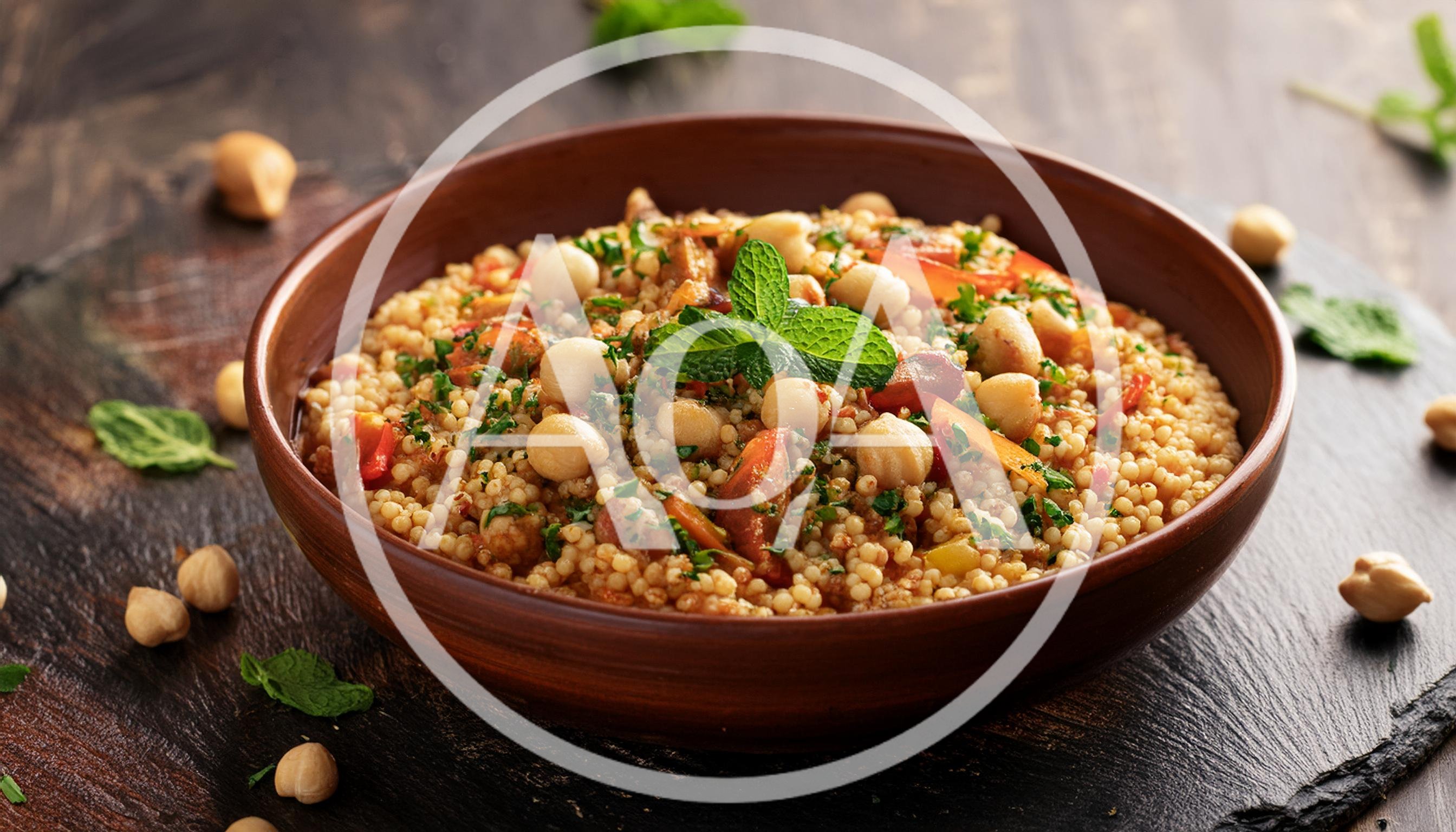 Bowl Of Couscous Salad With Chickpeas And Fresh Herbs