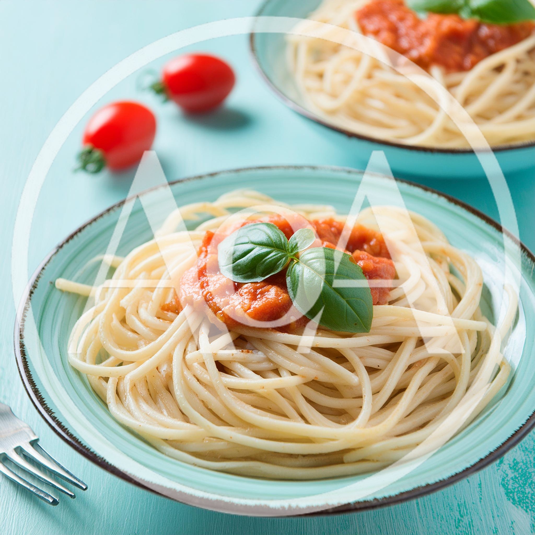 Two Plates Of Spaghetti With Tomato Sauce And Basil