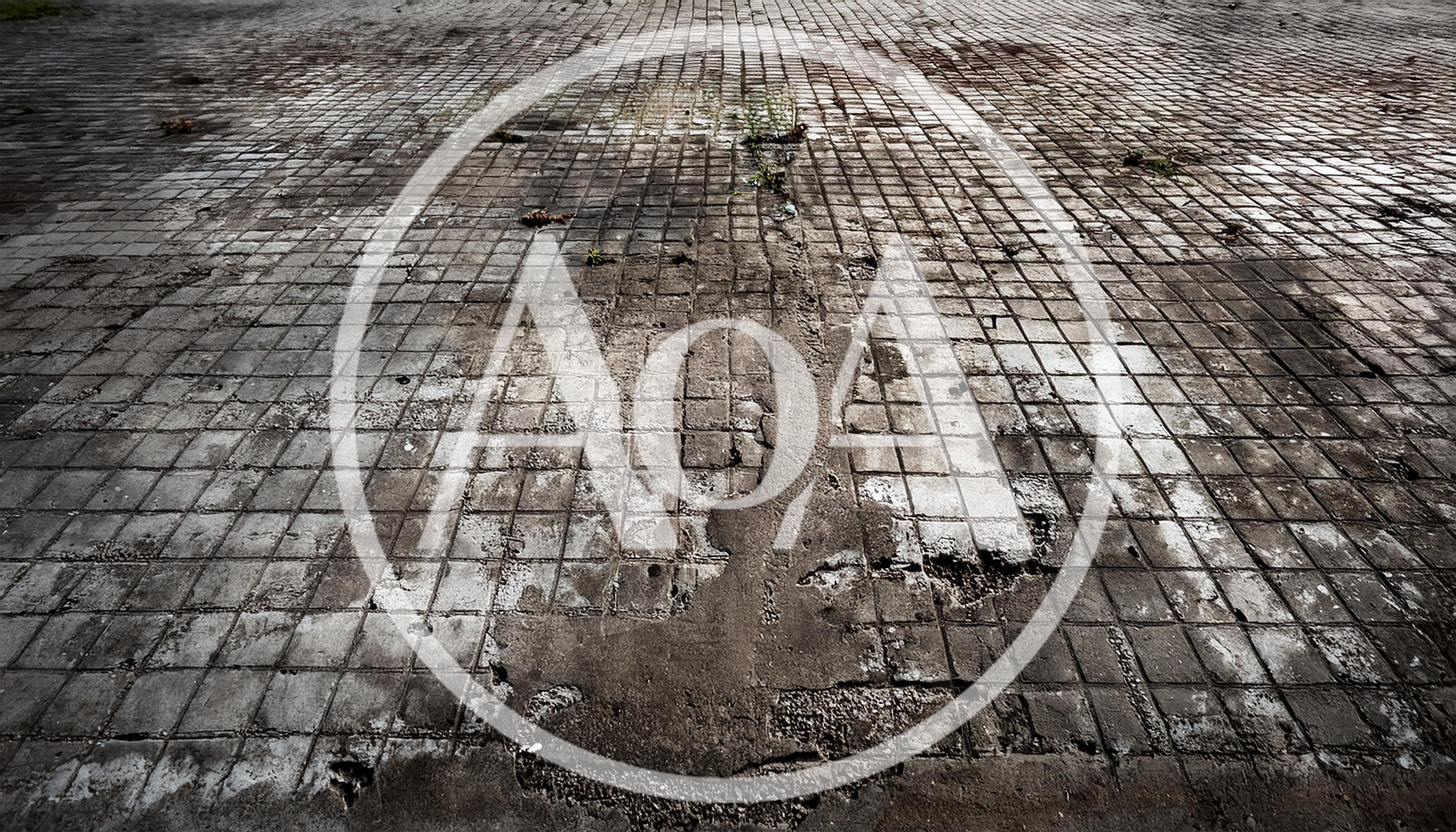 Worn And Cracked Concrete Tiled Ground Surface