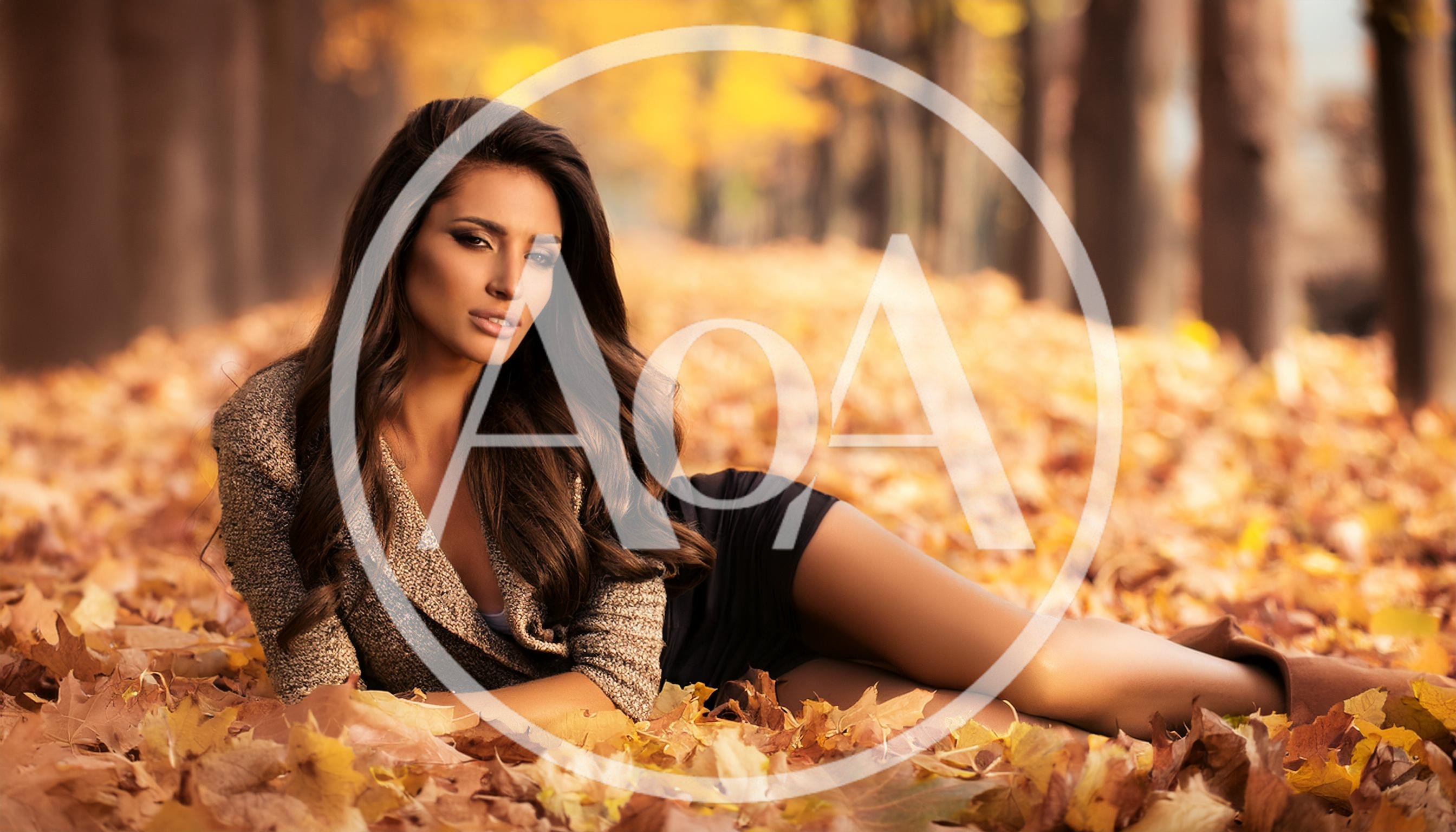 Beautiful Woman Lying In Autumn Leaves