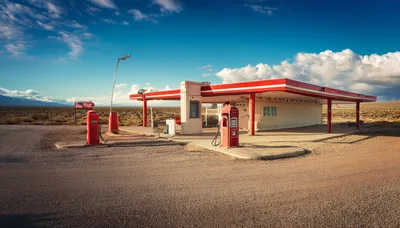 Abandoned Gas Station In The Desert Landscape