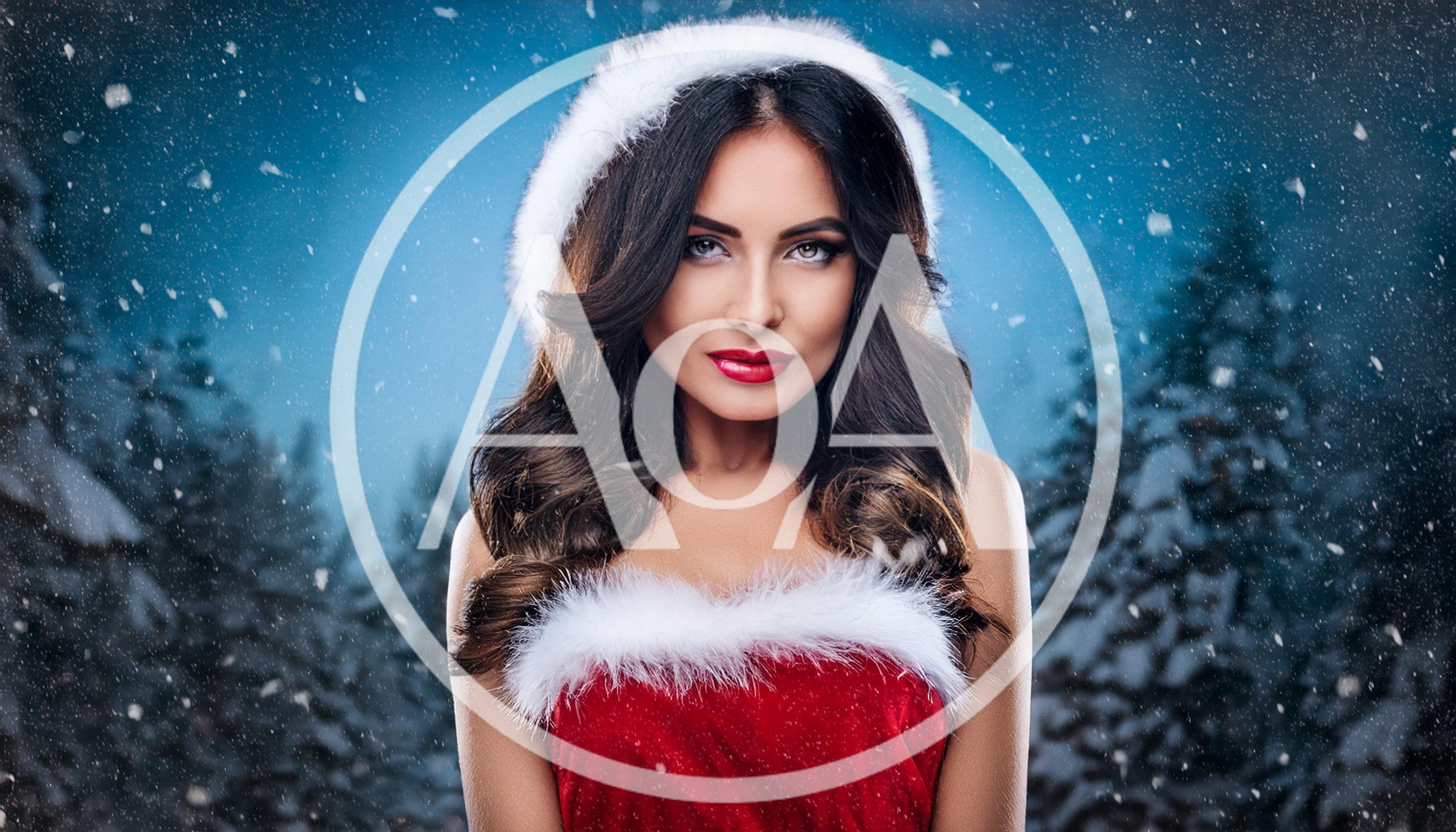 Beautiful Woman Wearing Santa Hat In Snowy Forest