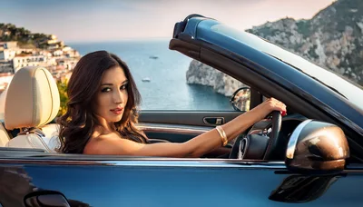 Beautiful Woman Driving A Convertible Along The Amalfi Coast