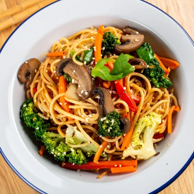 Stir Fried Vegetable Noodles In A White Bowl