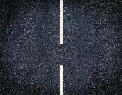 Top Down View Of Asphalt Road With White Markings