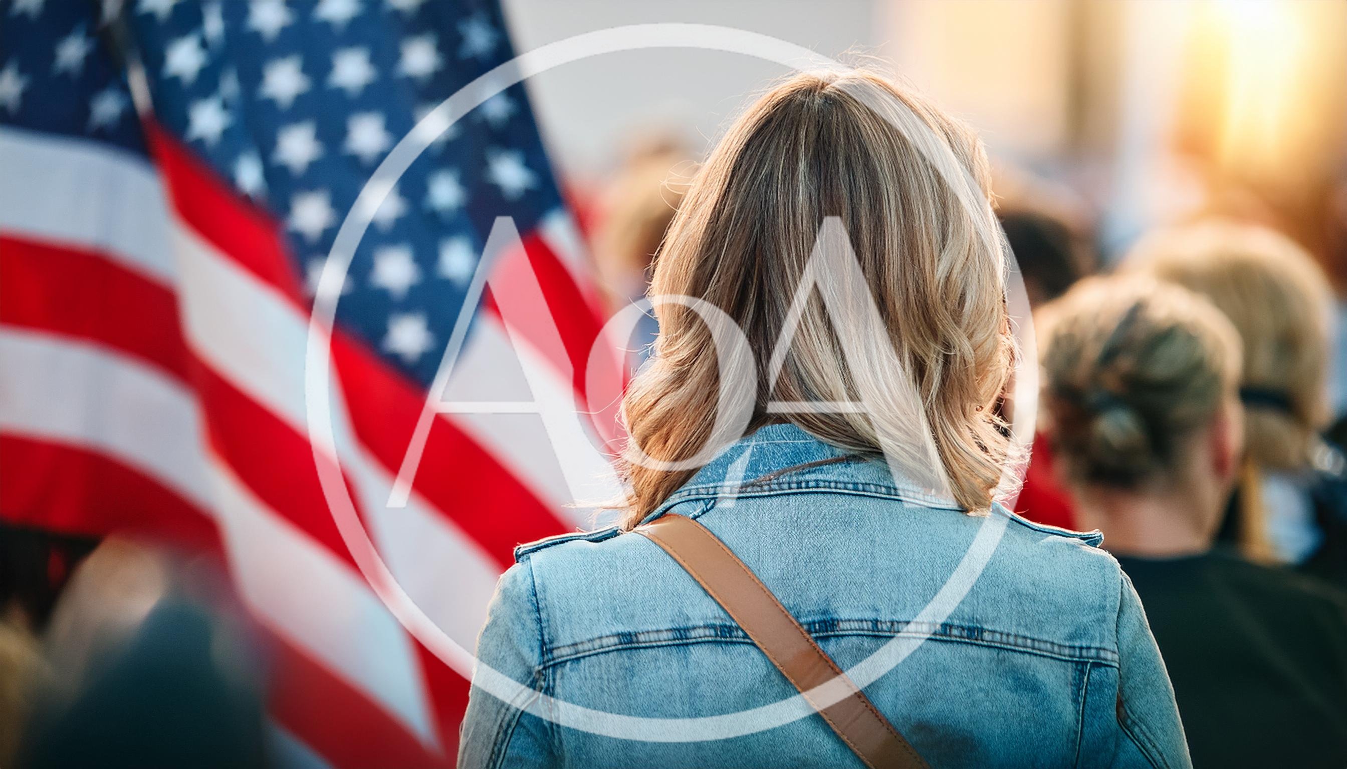 Woman Standing Before An American Flag