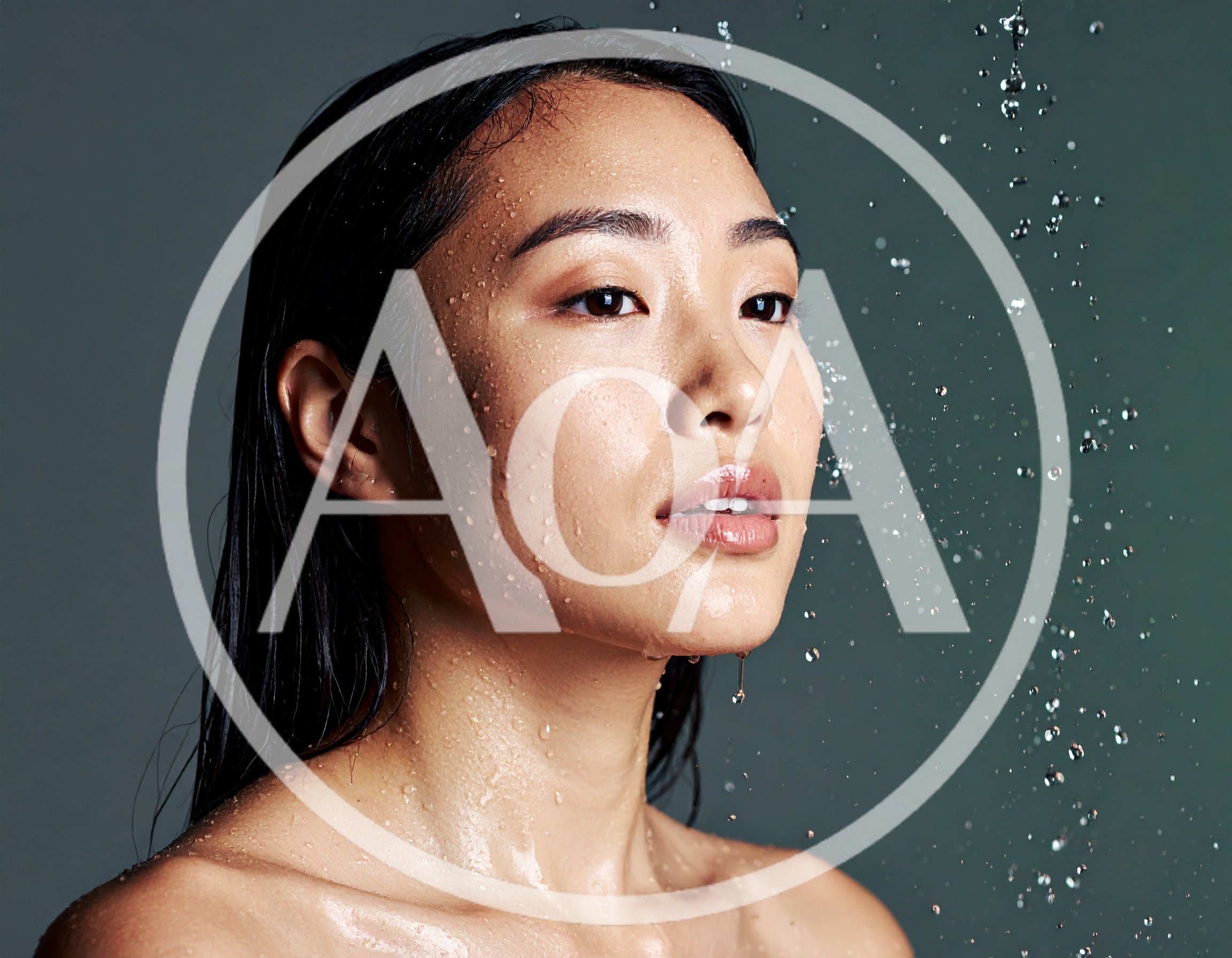 Young Asian Woman With Wet Skin Under Water Spray