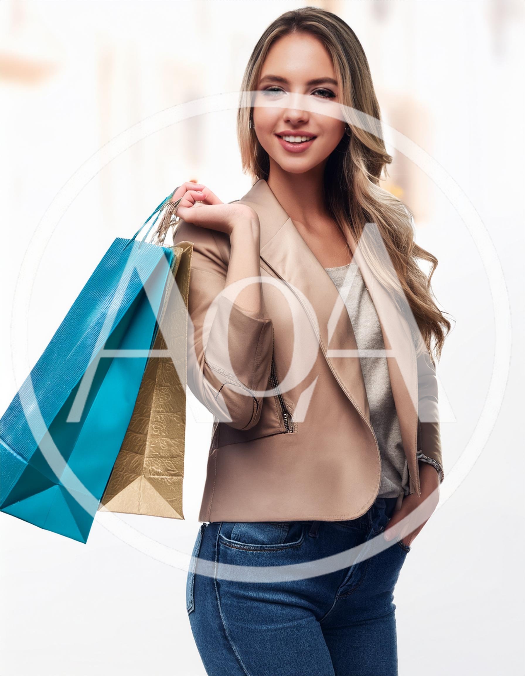 Young Woman Carrying Shopping Bags After A Day Out