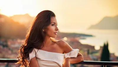 Beautiful Woman Leaning On Railing At Sunset