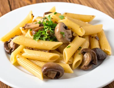 Penne Pasta With Sautéed Mushrooms And Fresh Parsley