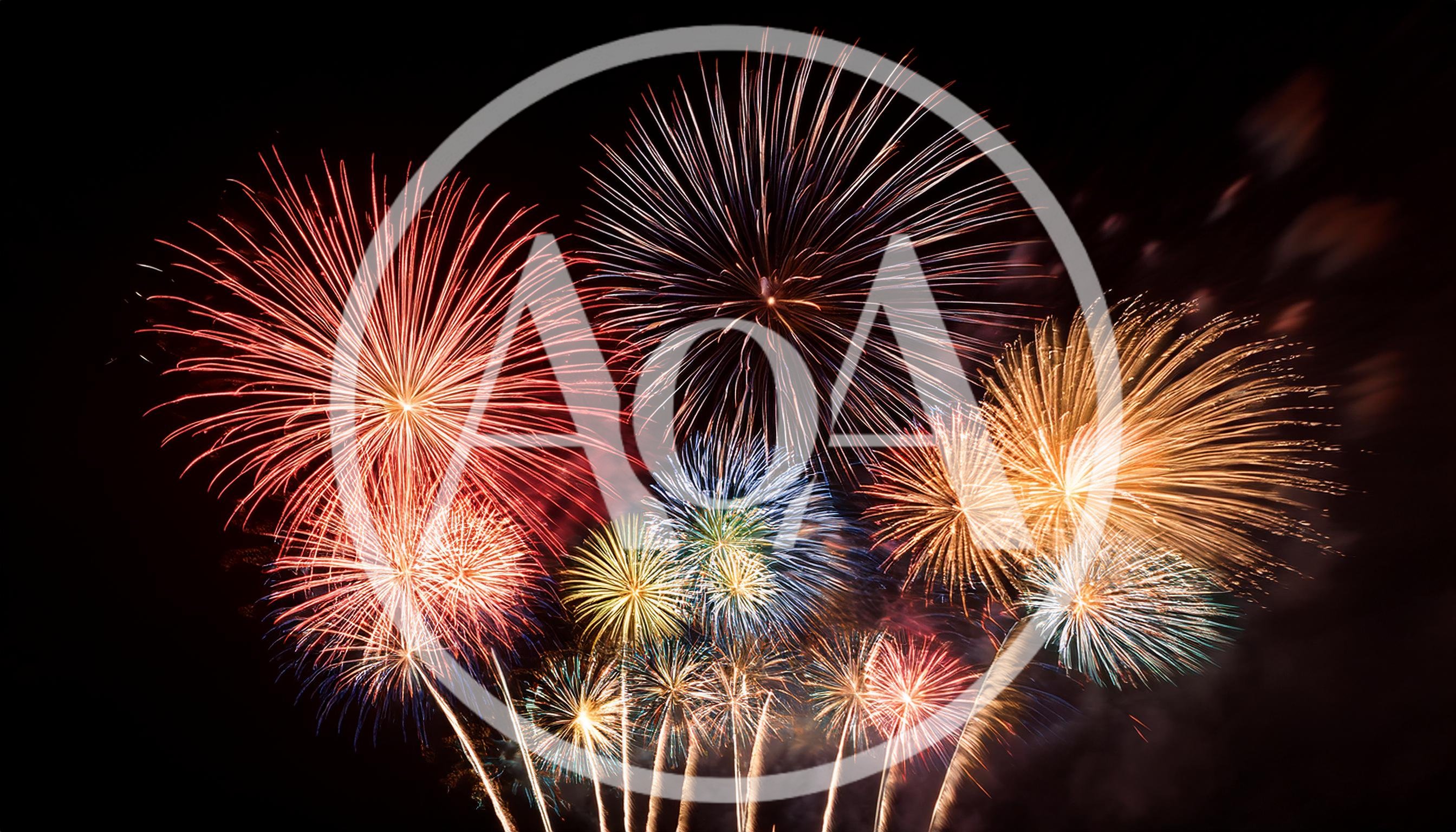 Vibrant Multi-Colored Fireworks Display Against Night Sky