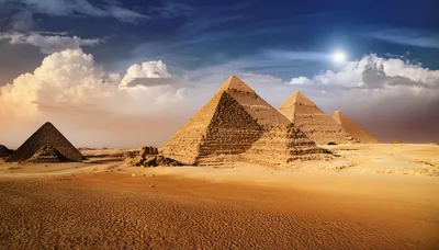 The Great Pyramids Of Giza Under A Dramatic Sky