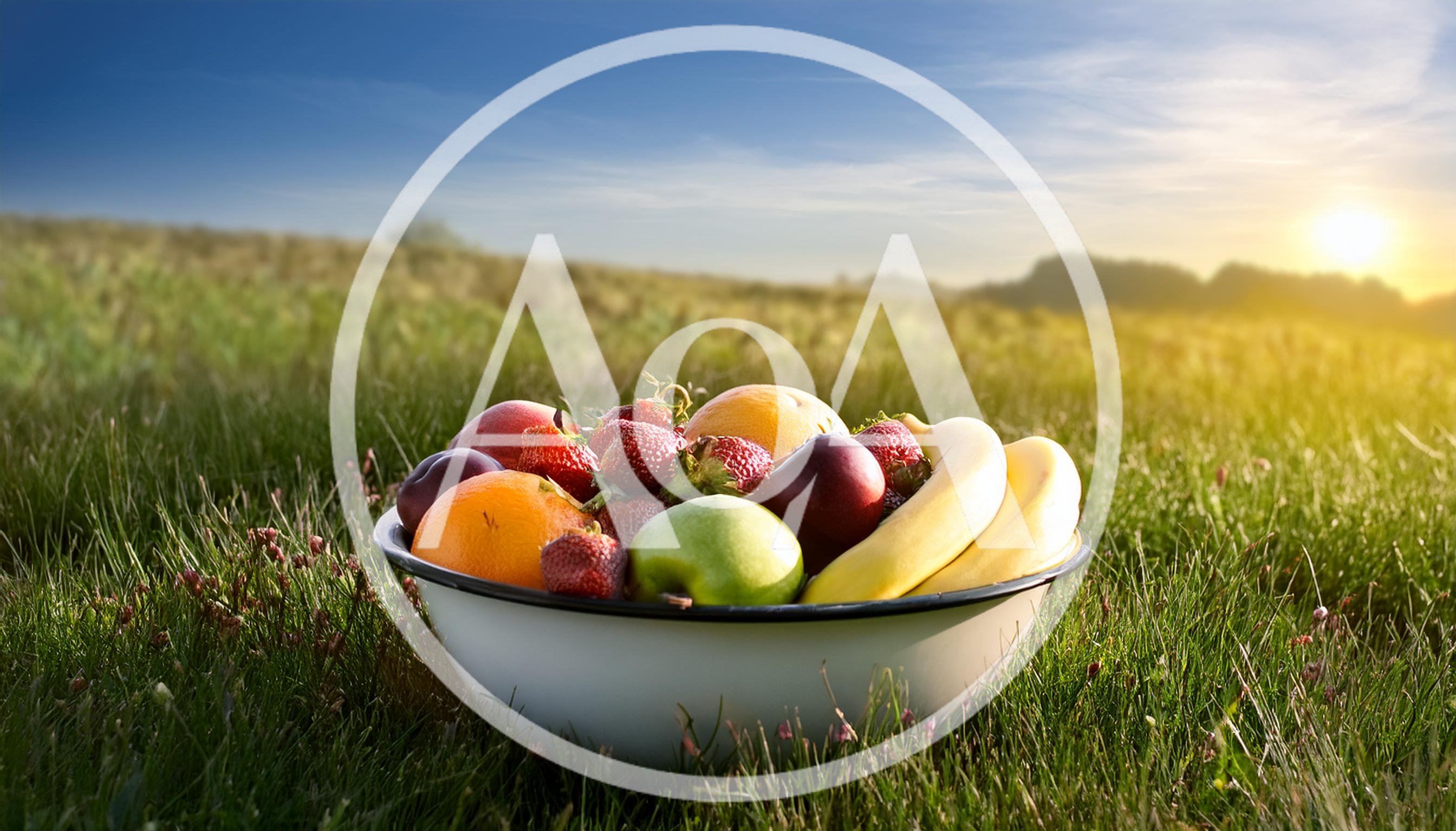 Bowl Of Fresh Fruit In A Grassy Field