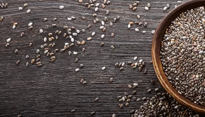 Chia Seeds In A Wooden Bowl On Dark Wood