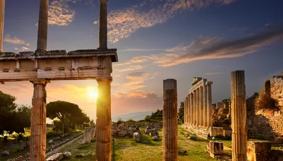 Ancient Greek Temple Ruins At Sunset In Delphi