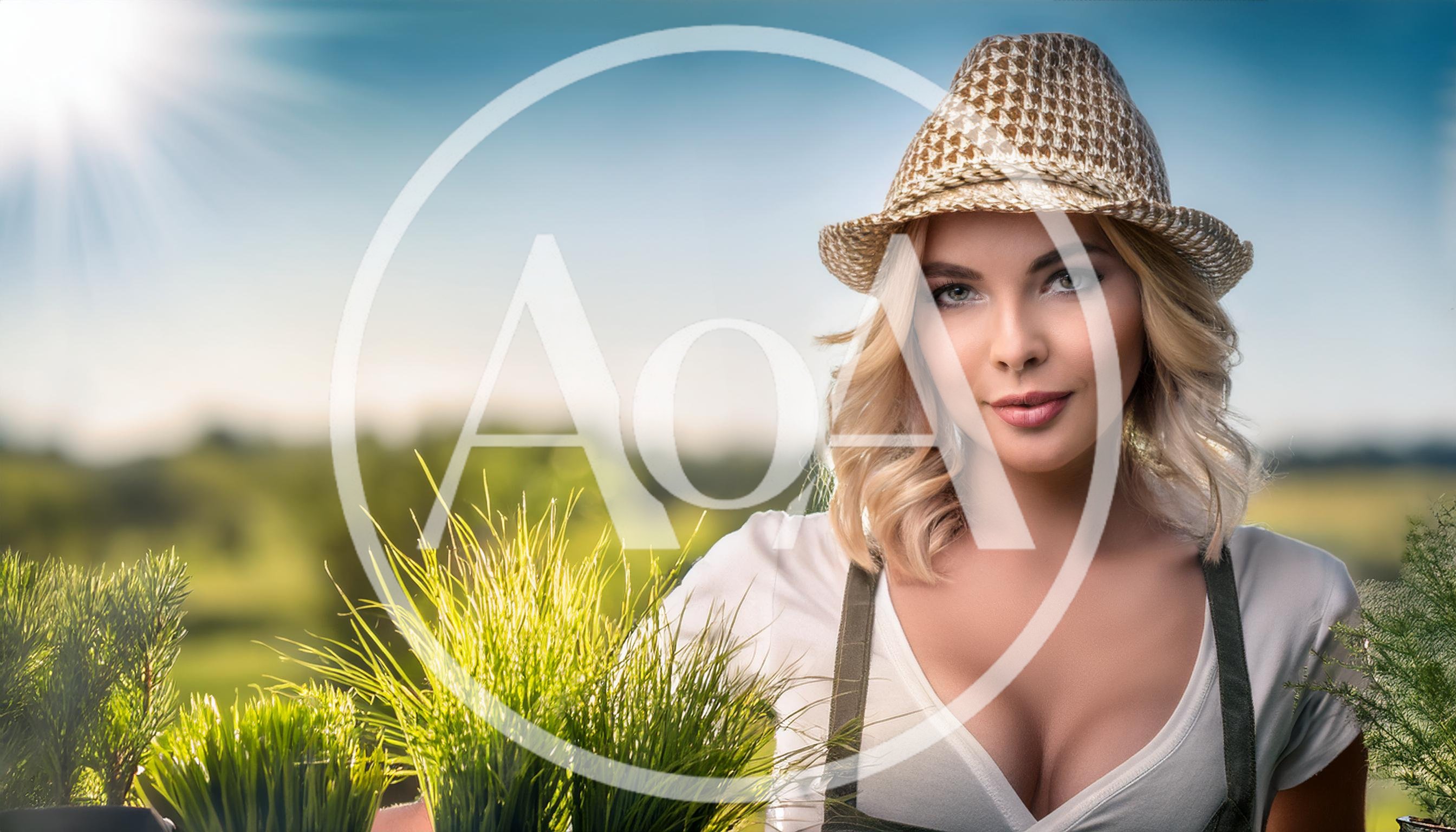 Beautiful Woman Holding Potted Plants In Sunny Garden