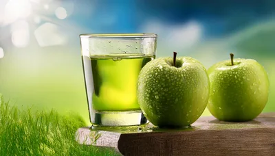 Glass Of Fresh Green Apple Juice With Whole Apples