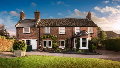 Traditional English Brick Cottage With A Lush Garden