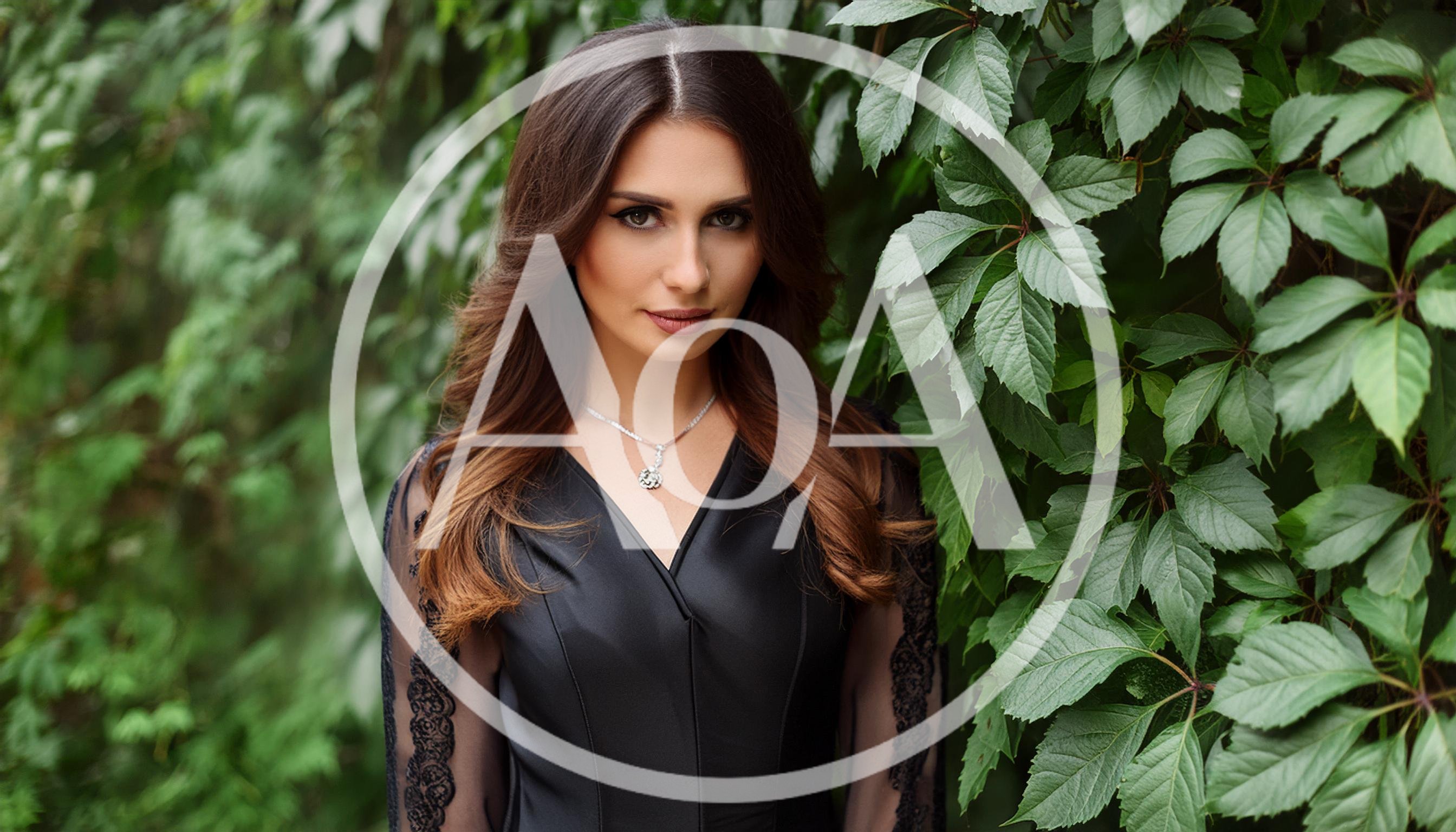 Portrait Of A Beautiful Woman In A Black Dress