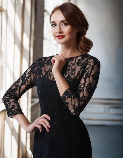 Elegant Woman In Black Lace Dress Posing Indoors