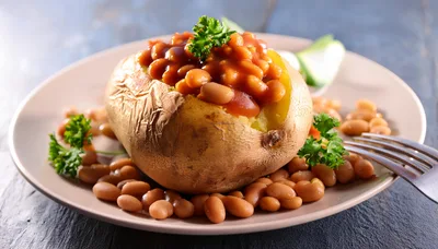 Baked Potato Topped With Beans On A Plate