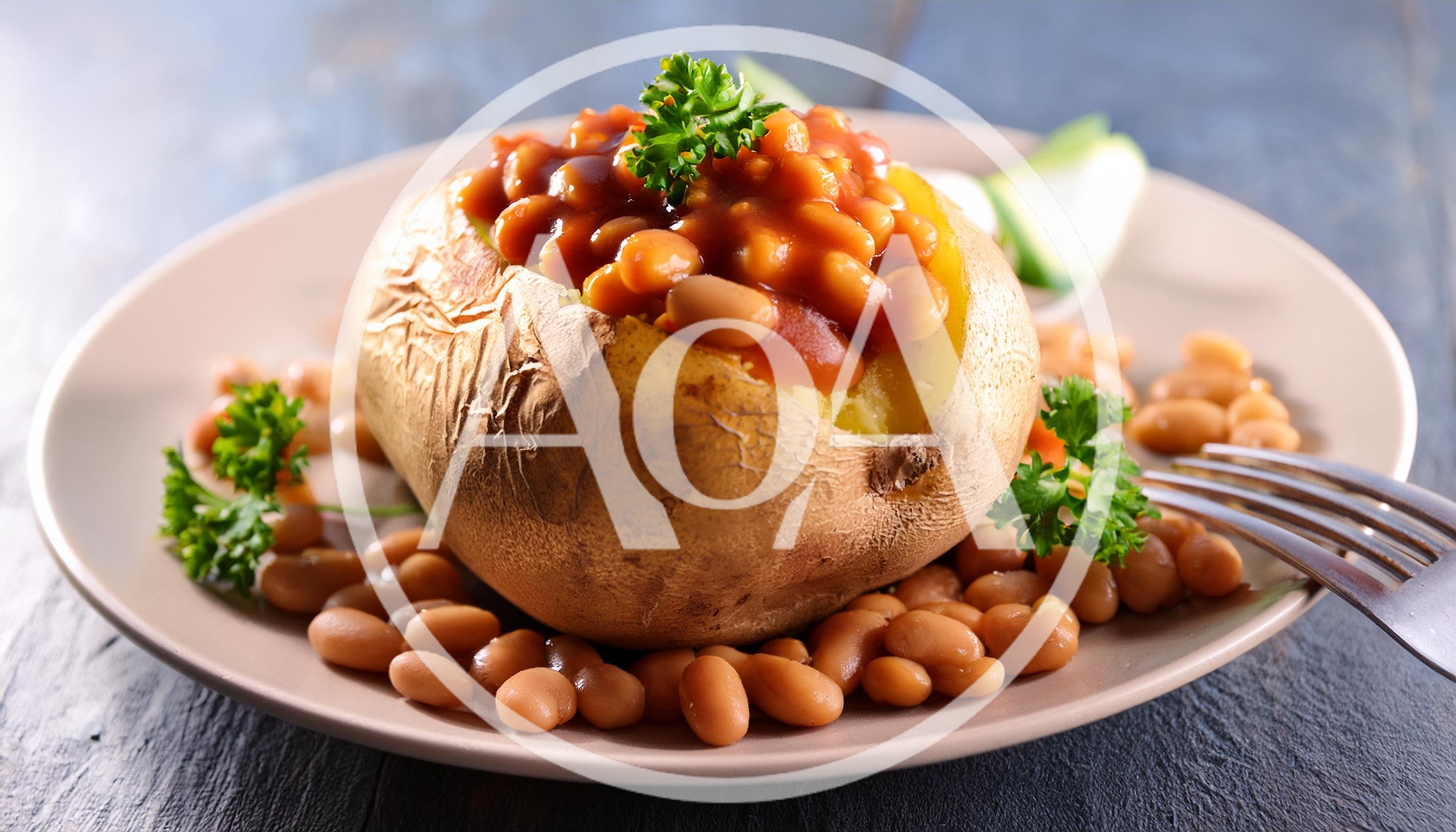 Baked Potato Topped With Beans On A Plate