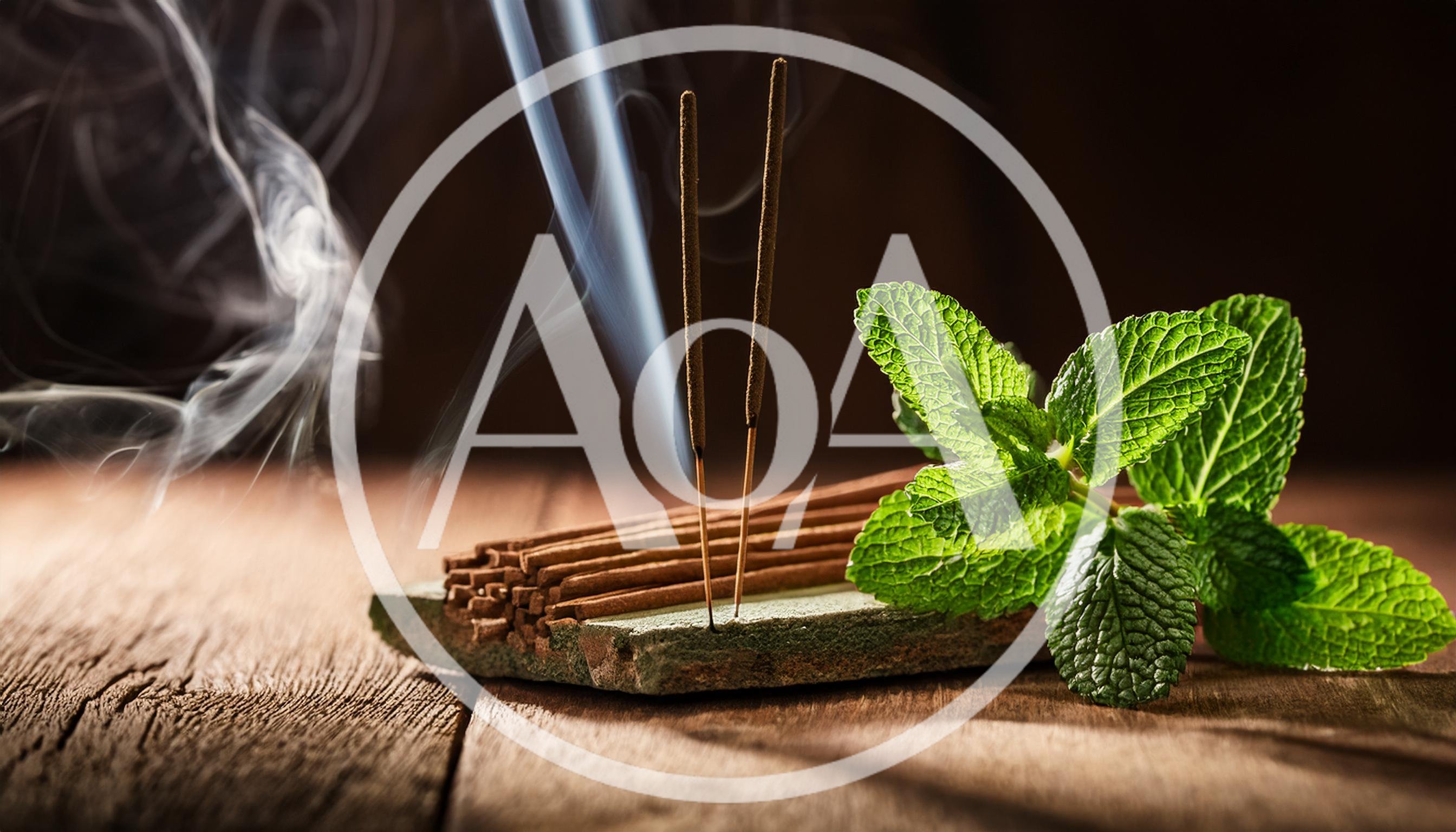 Two Burning Incense Sticks With Fresh Mint Leaves